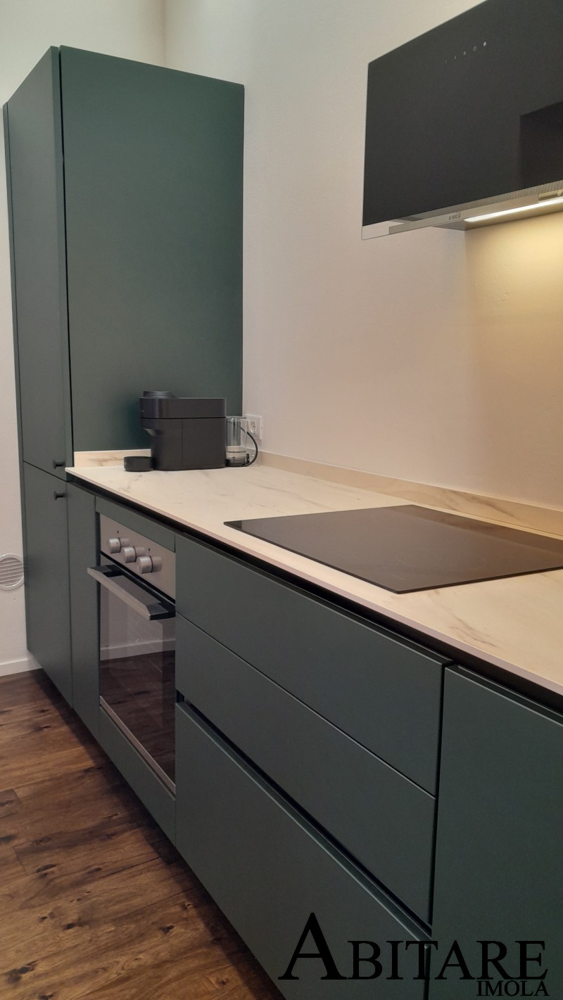 arredare casa interior design imola cucina verde alpi snaidero piano induzinoe cappa vetro top hpl effetto marmo frigo incasso bologna lugo faenza